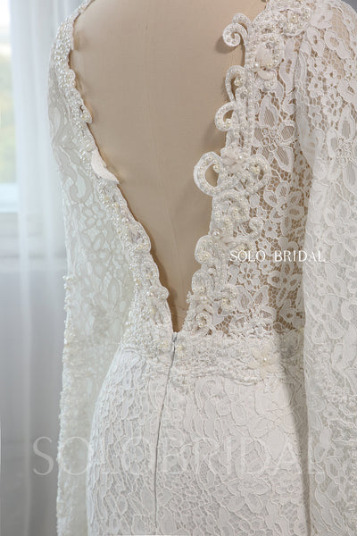 Heavily Pearl Beaded V neck Long Sleeve Wedding Dress with Cathedral Train